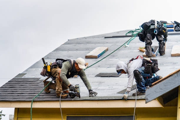 Professional Roofing technician working in Slickville, PA